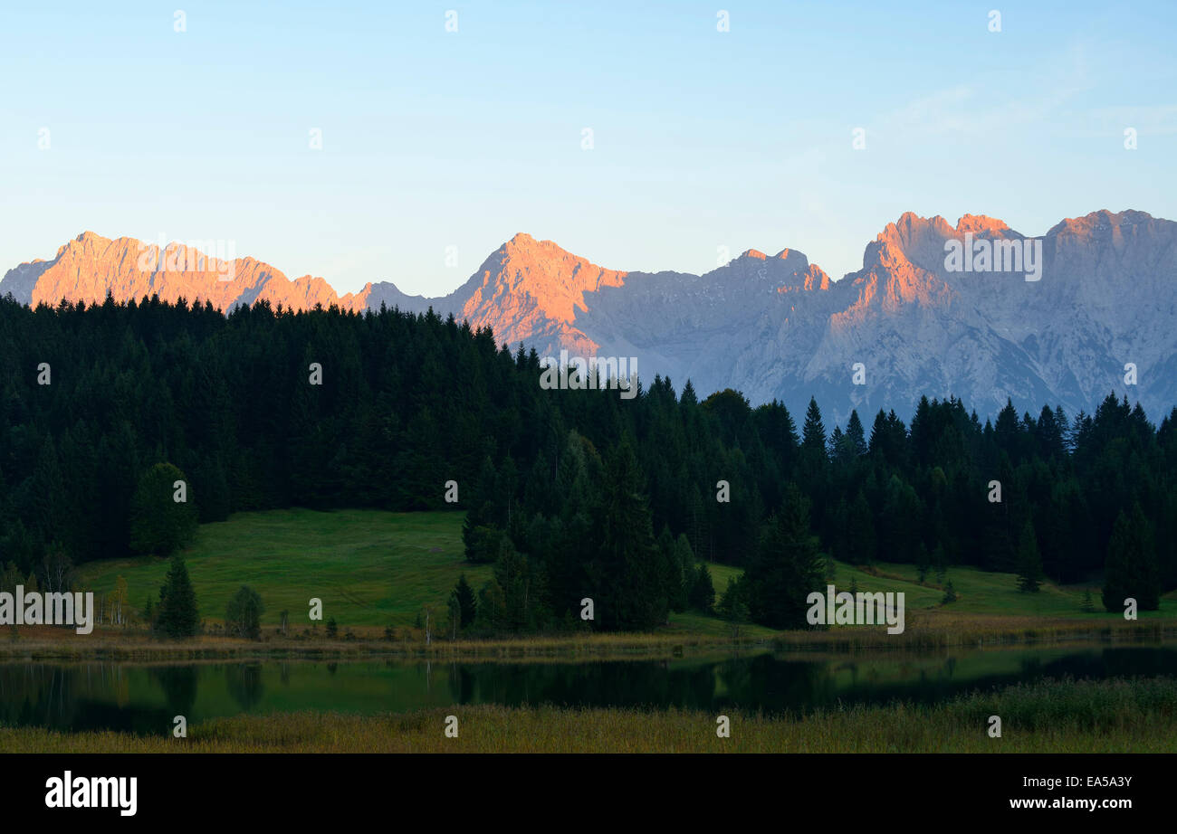 Germany, Bavaria, Upper Bavaria, Werdenfelser Land, Geroldsee lake and Karwendel mountains at sunset Stock Photo