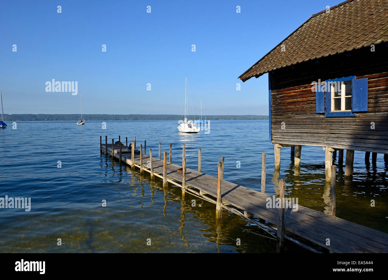 Germany, Bavaria, Upper Bavaria, near Herrsching, Ammersee lake, boathouse and wooden jetty Stock Photo