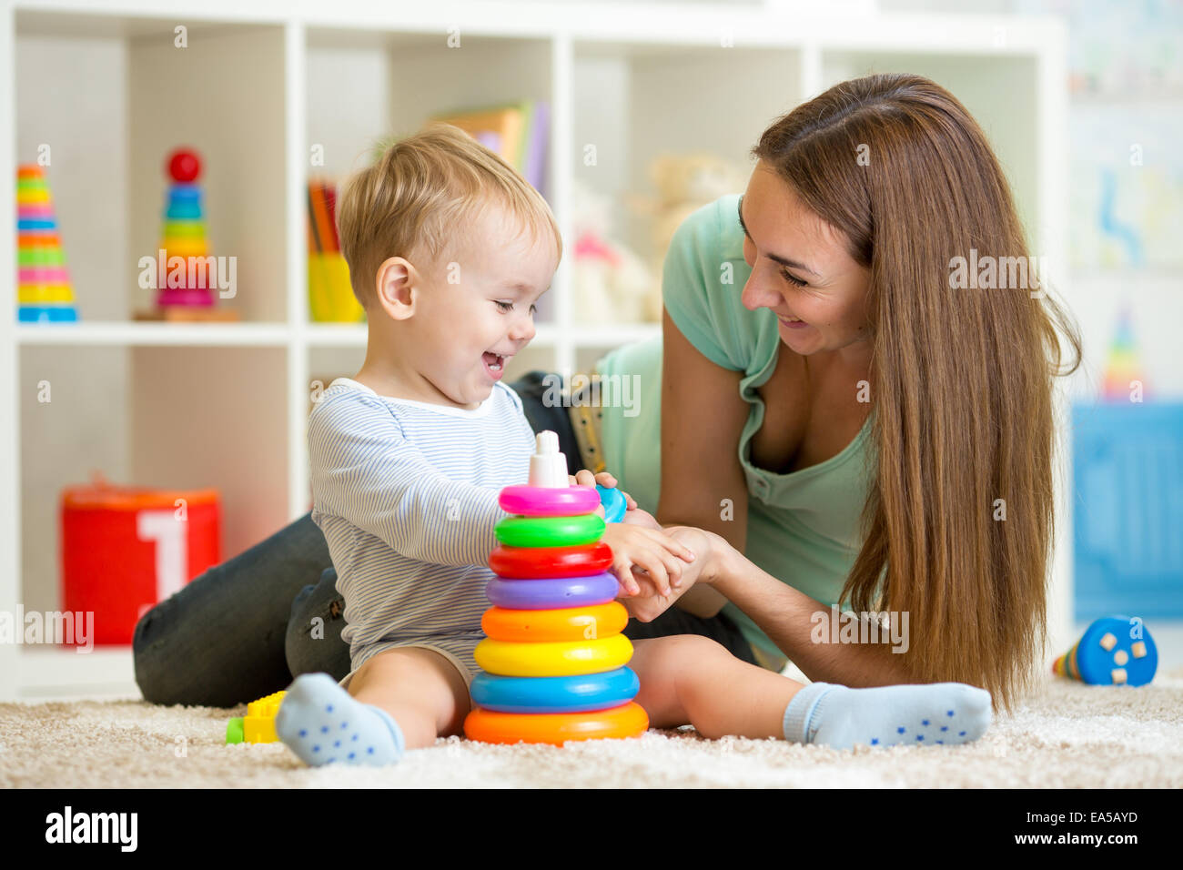 cute mother and child boy play together indoor at home Stock Photo - Alamy