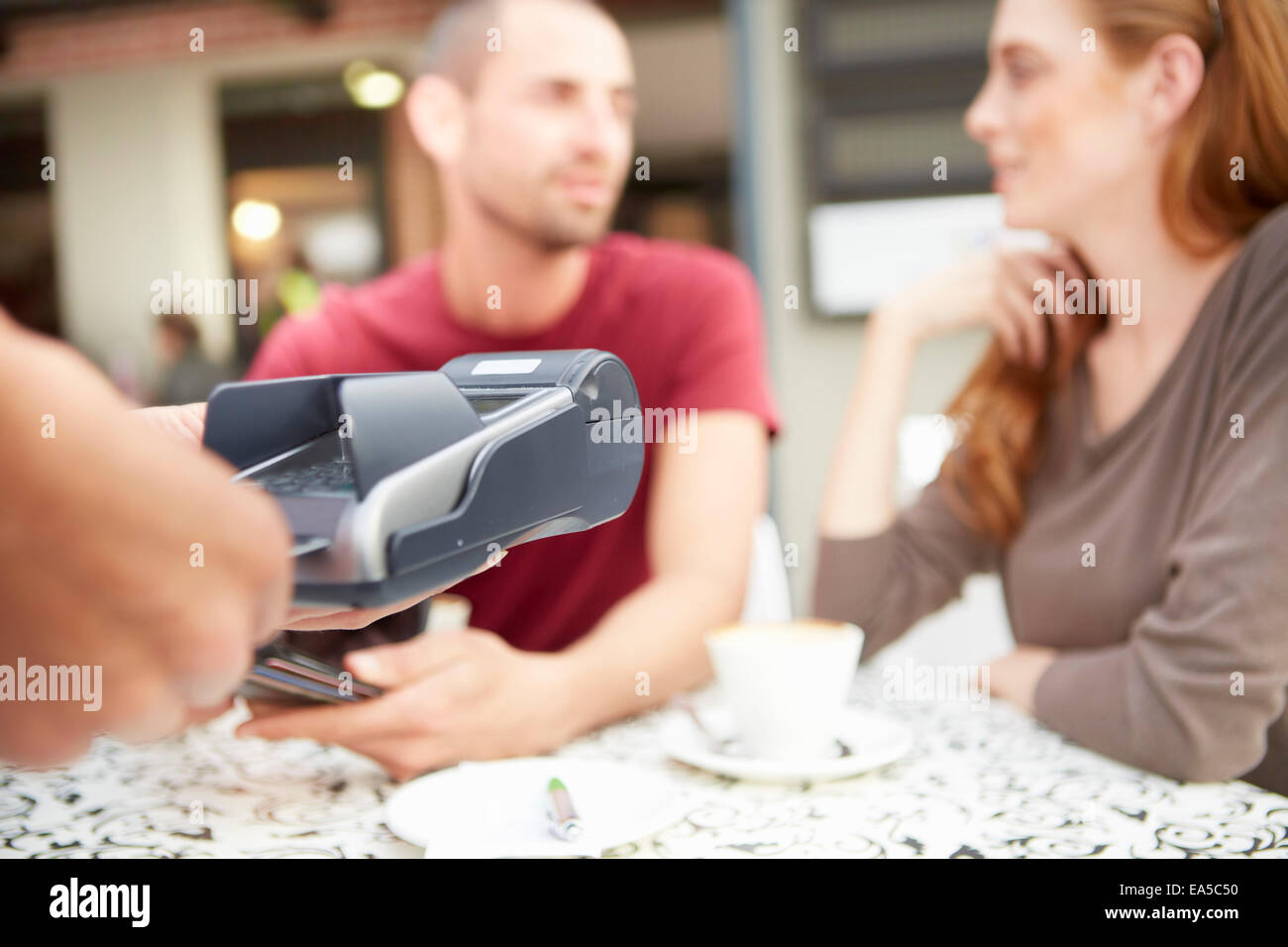 Service using credit card reader in a pavement cafe Stock Photo - Alamy