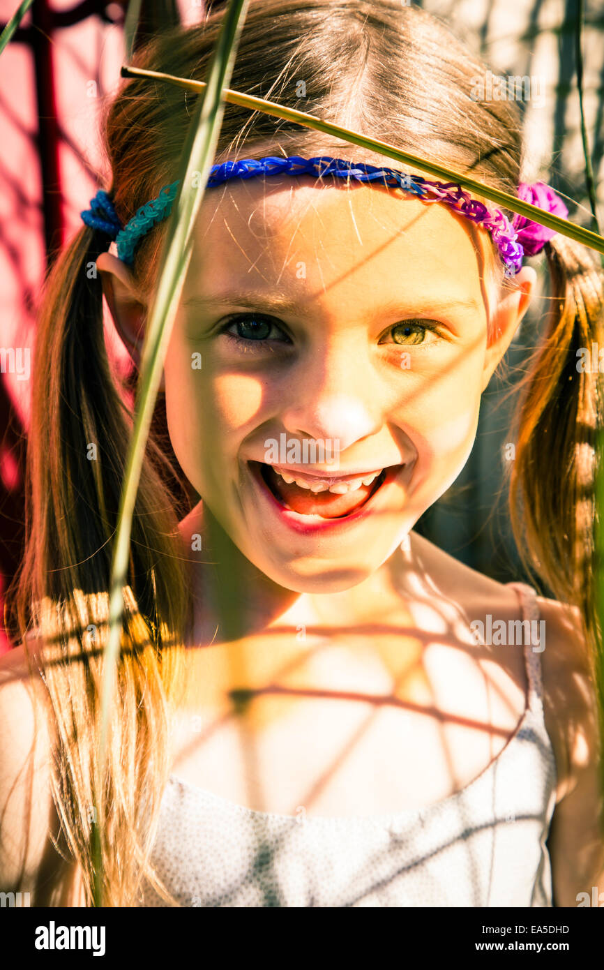 Portrait of smiling little girl in summer Stock Photo - Alamy