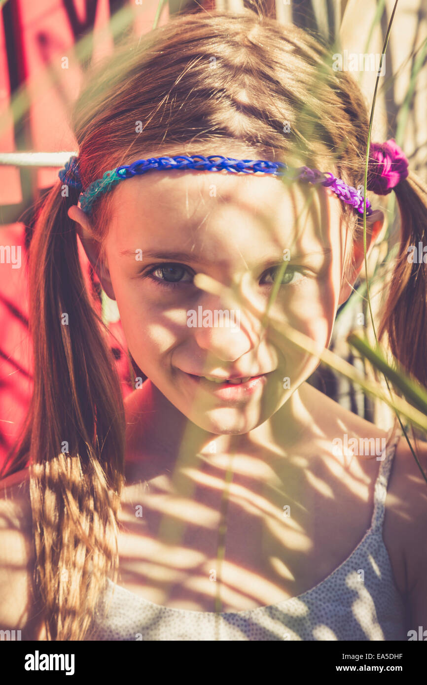 Portrait of smiling little girl in summer Stock Photo - Alamy