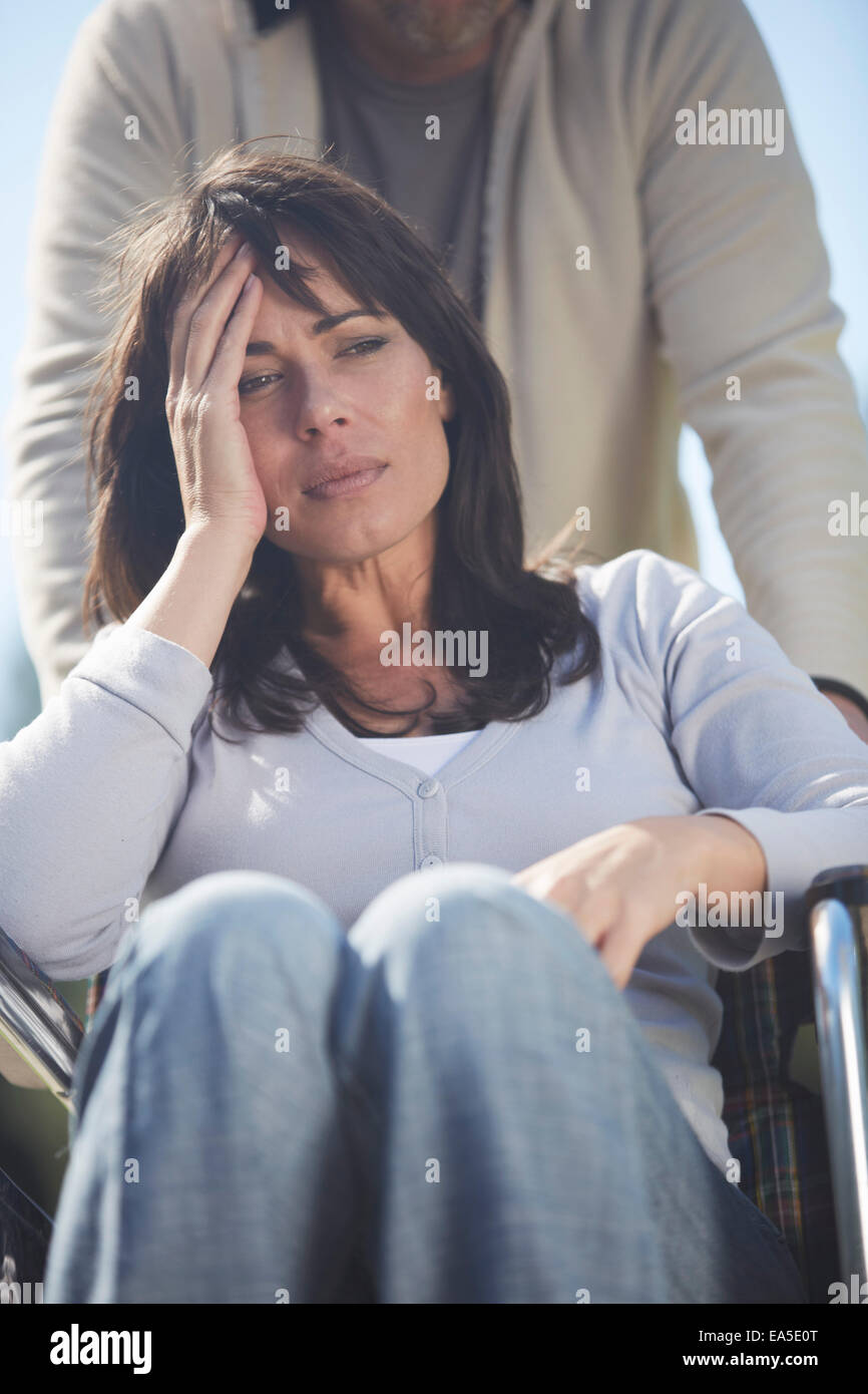Sad woman in wheelchair hi-res stock photography and images - Alamy