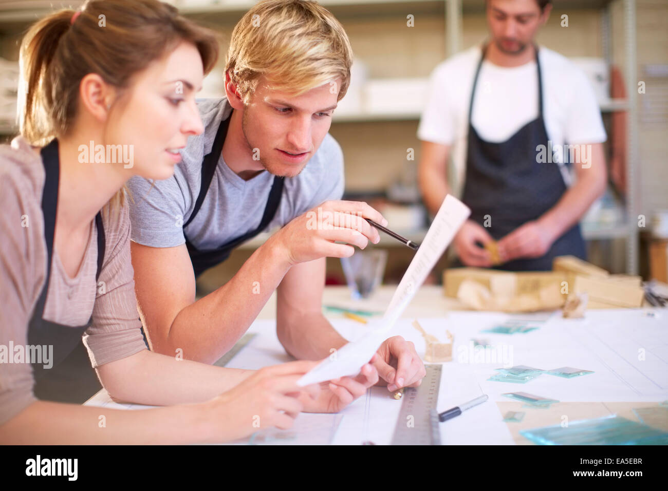 Couple in a workshop manufacturing stained glass Stock Photo - Alamy