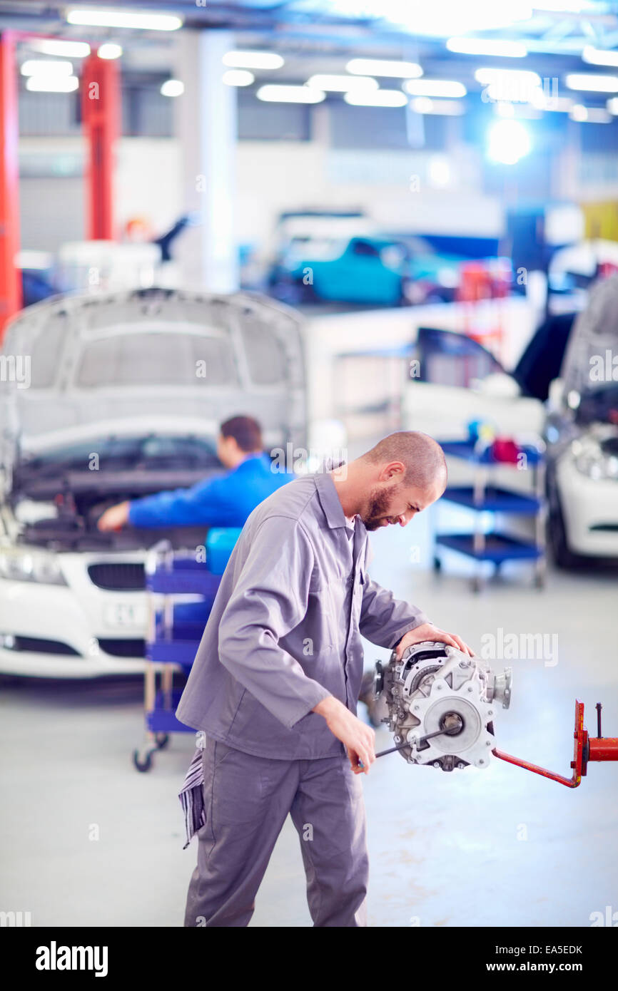 Car mechanic working on gearbox in repair garage Stock Photo Alamy