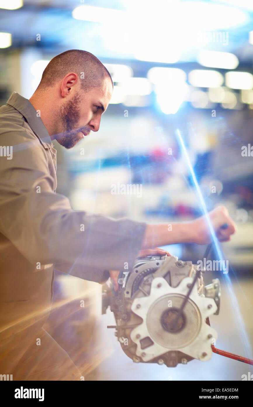 Car mechanic working on gearbox in repair garage Stock Photo Alamy
