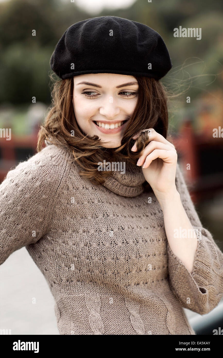 Portrait of young woman wearing knitted dress and beret Stock Photo - Alamy