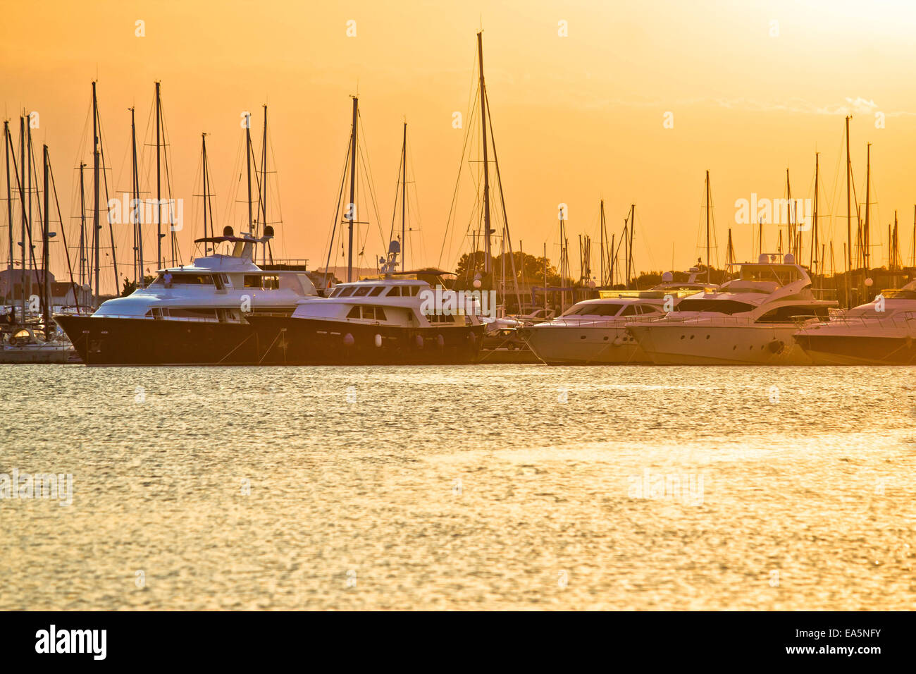 Golden sunset at yacht club Stock Photo