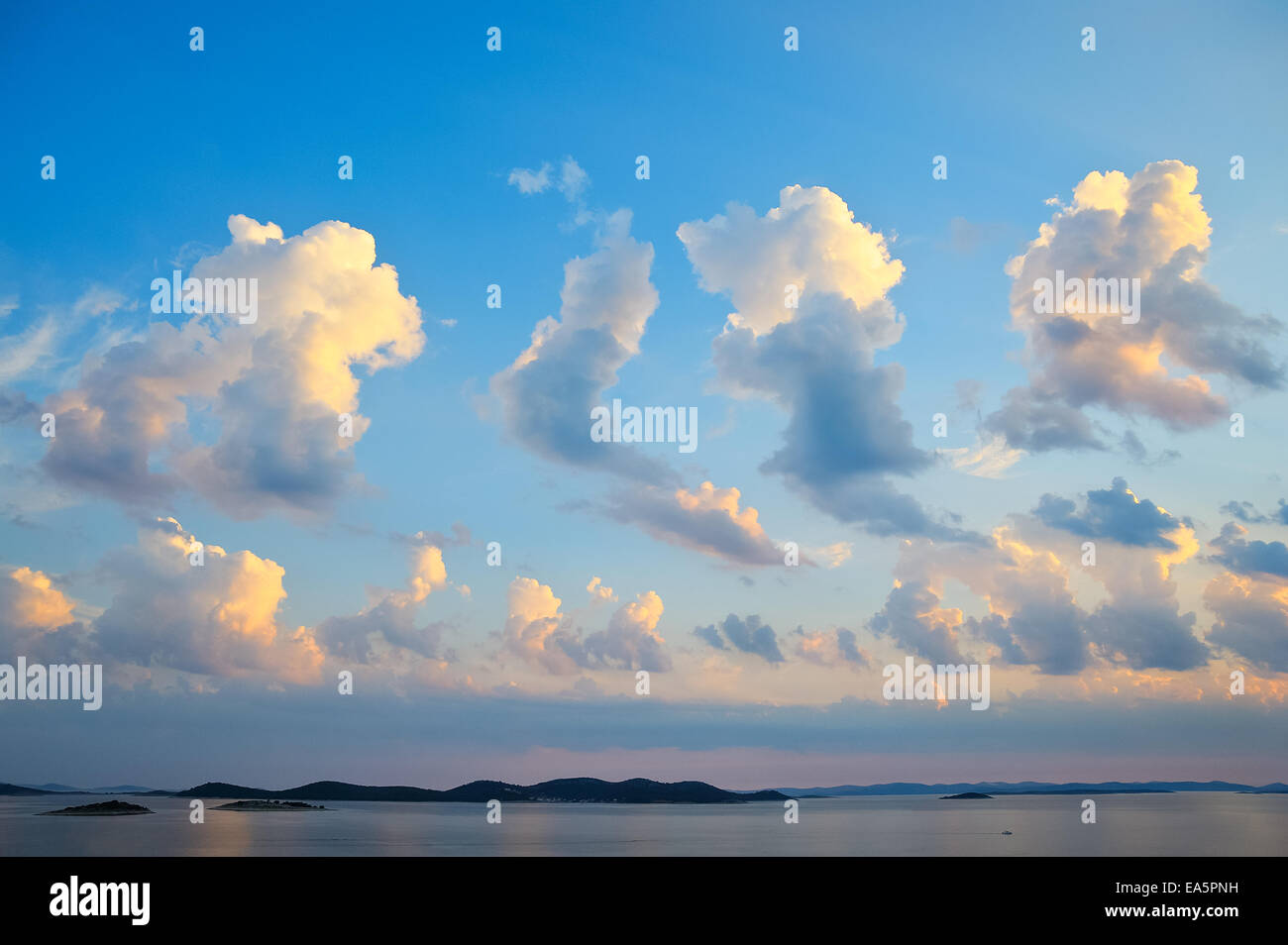 Spectacular clouds over the sea and islands Stock Photo