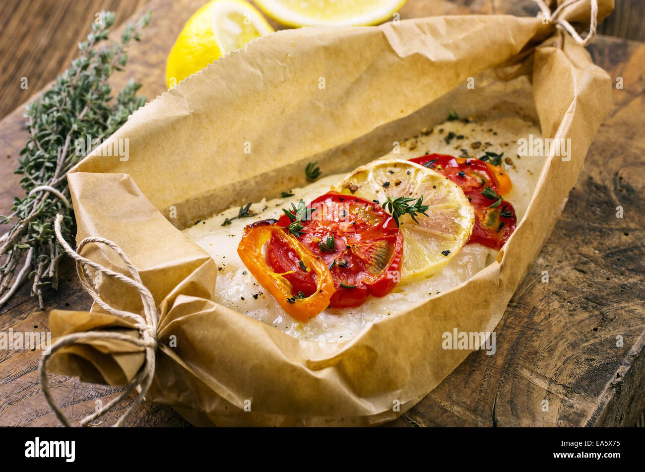 fish oven baked with vegetables Stock Photo Alamy