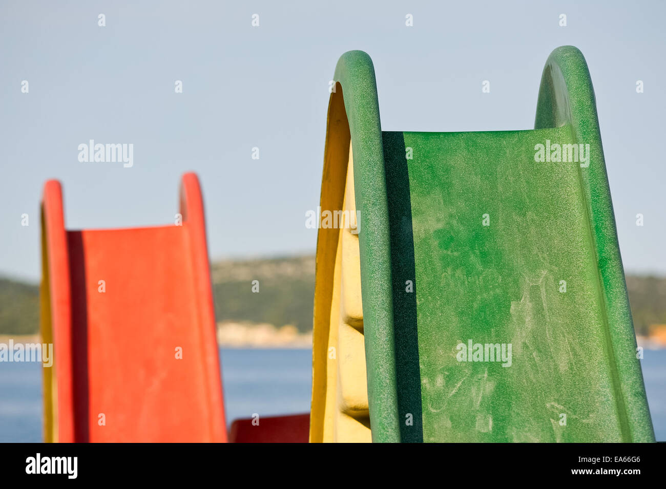Slide on a playground by the sea Stock Photo