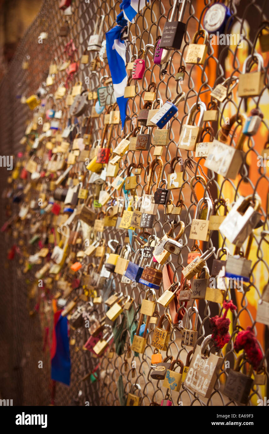 Love padlocks attached to fence in Shoreditch, London,UK Stock Photo