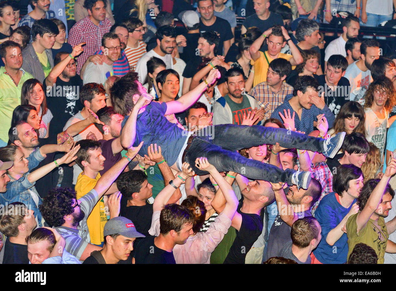 BARCELONA - MAY 30: The audience doing crowd surfing (also known as mosh pit) at Heineken Primavera Sound 2014 Festival. Stock Photo