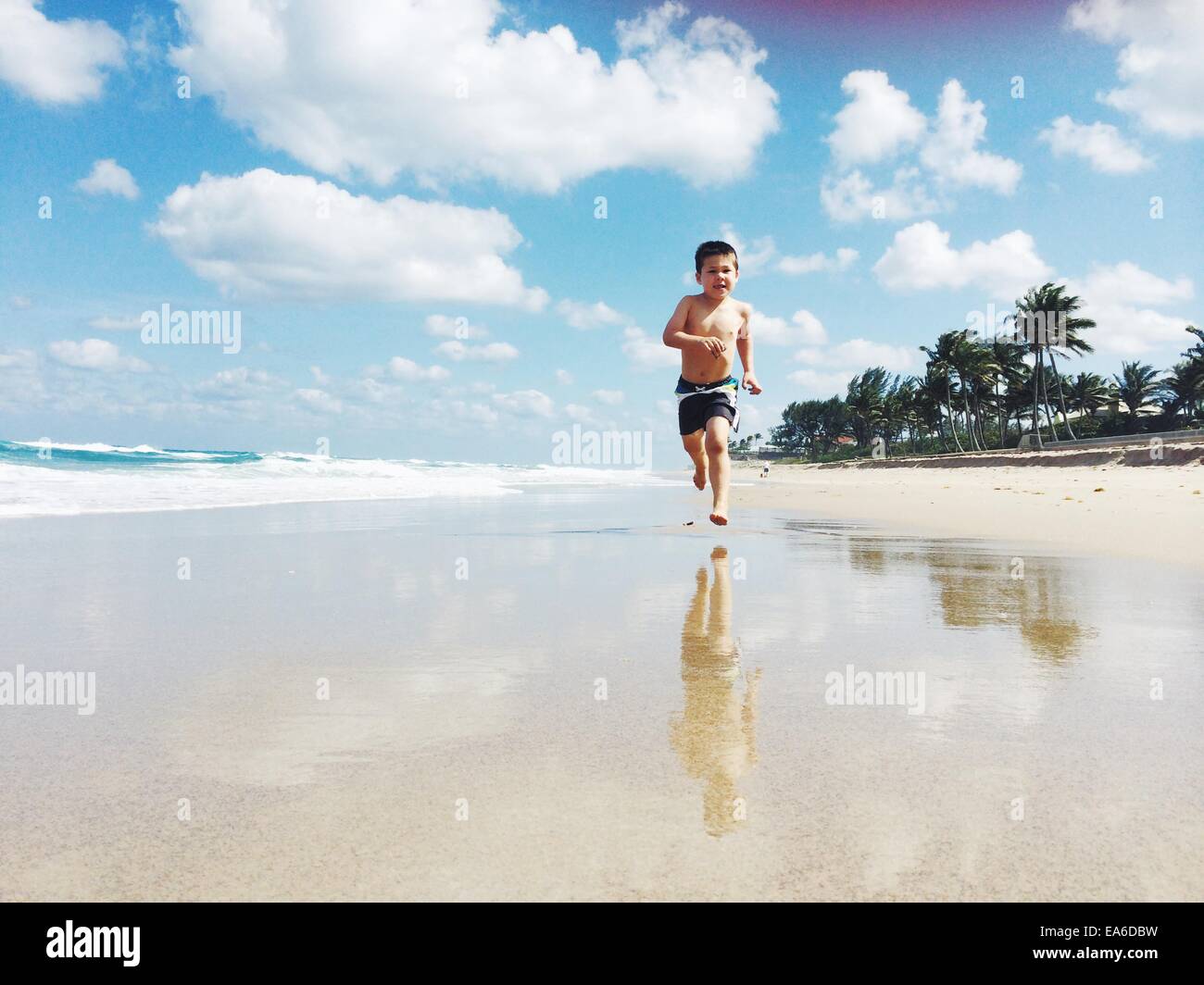 USA, Florida, Palm Beach County, West Palm Beach, Boy (2-3) running on beach Stock Photo
