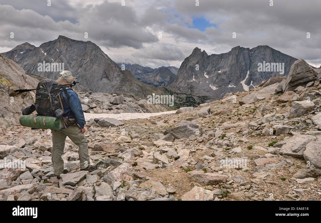 USA, Wyoming, Bridger-Teton National Forest, Hiker looking back at Cirque of Towers from Texas Pass Stock Photo