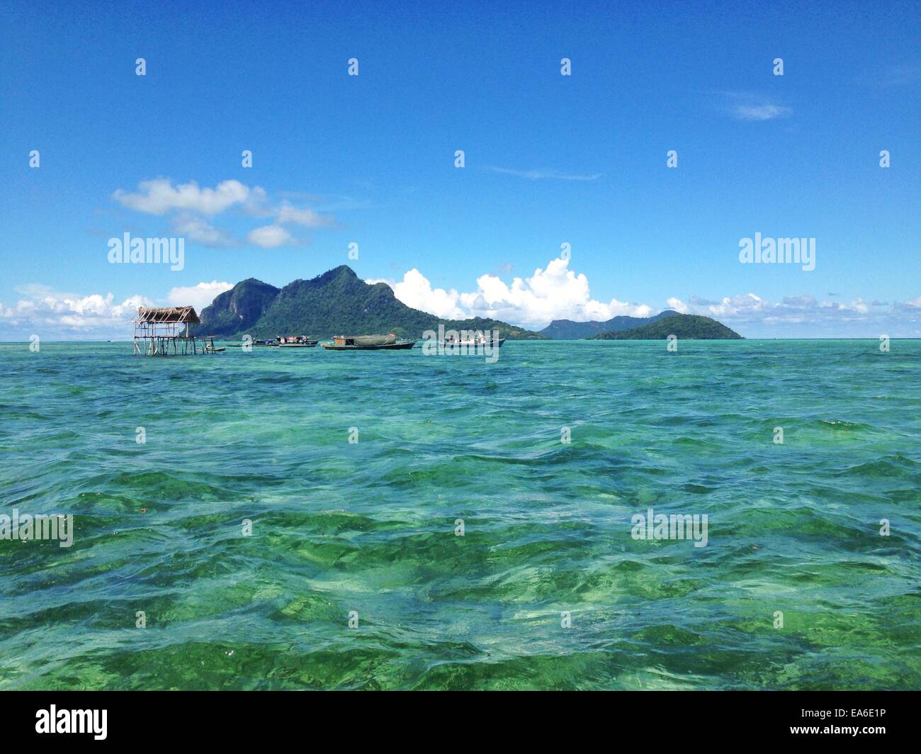 Malaysia, Sabah, Sea gypsy huts and island Stock Photo