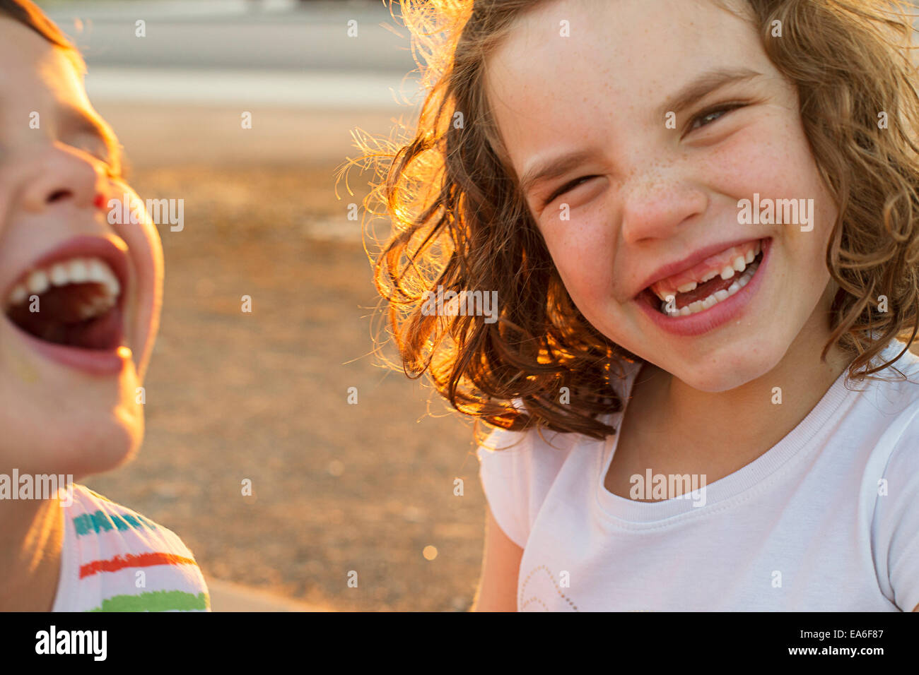 Portrait of two happy children laughing Stock Photo