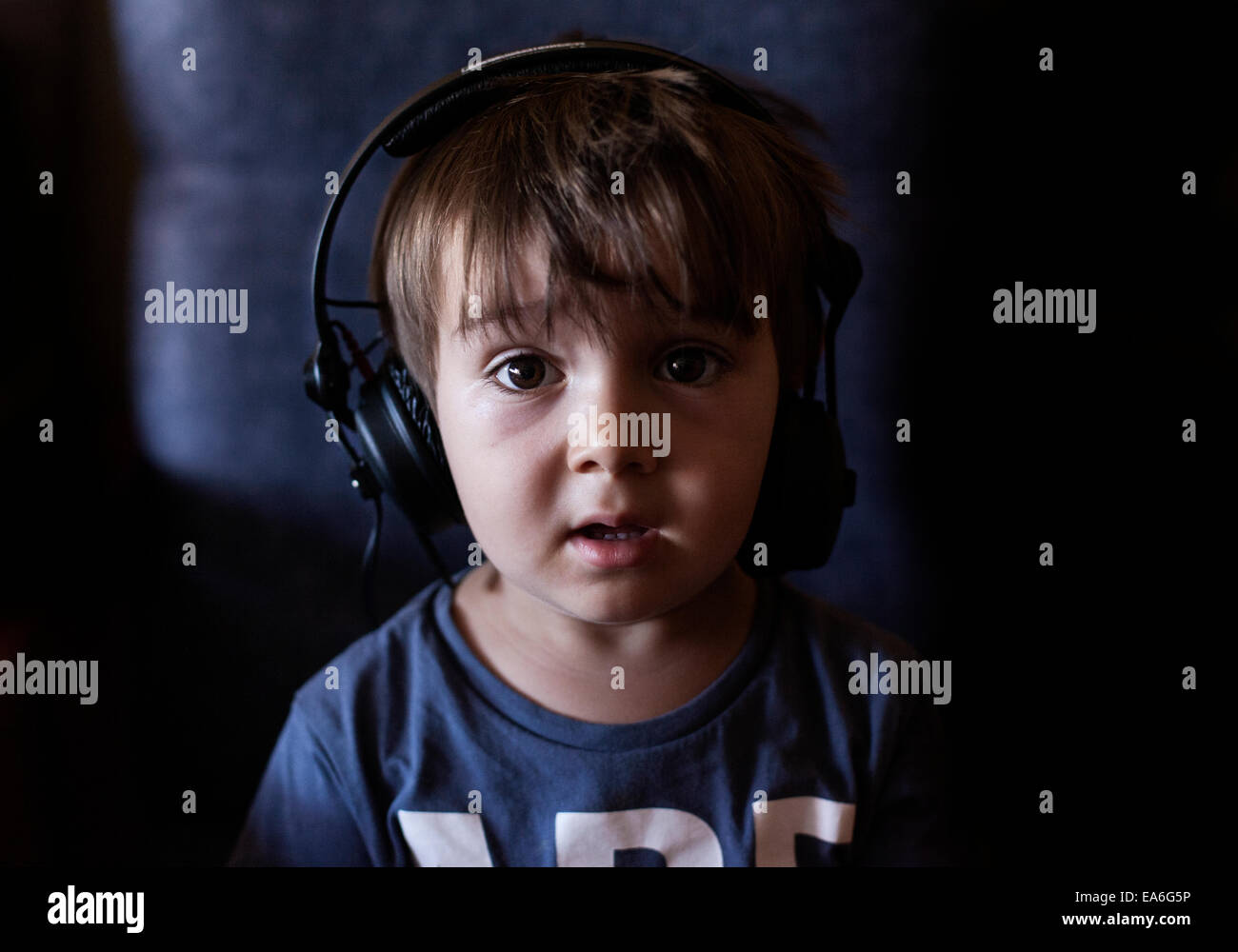 Boy listening to music headphones hires stock photography and images