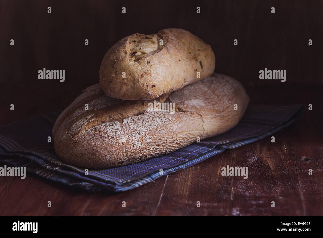 Two Loaves of bread on a table Stock Photo