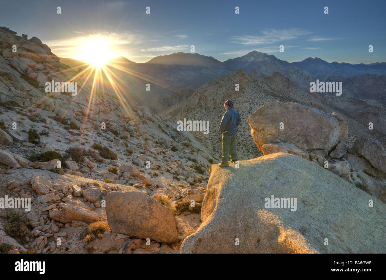 USA, California, Hiker Looking Into Sunset Below Five Fingers Stock Photo