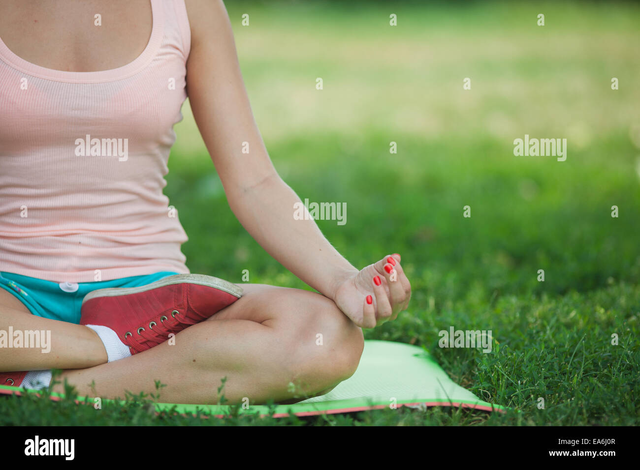 young girl sitting in the lotus position Stock Photo - Alamy
