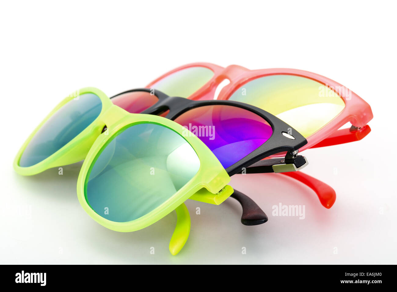 Few Very Bright Sunglasses Eyewear, closeup on white background Stock Photo