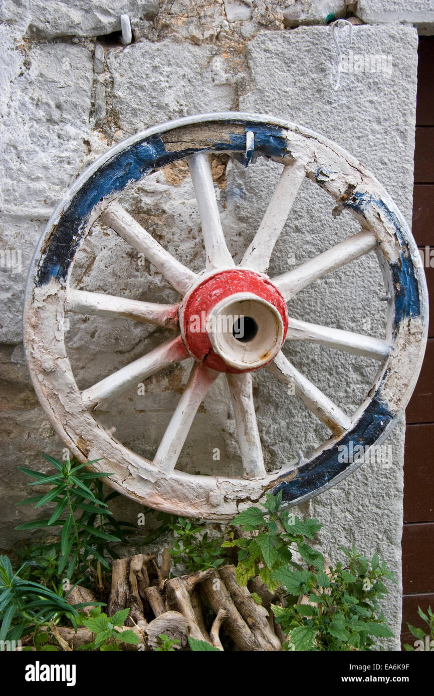 old wagon wheel painted in new colors Stock Photo Alamy