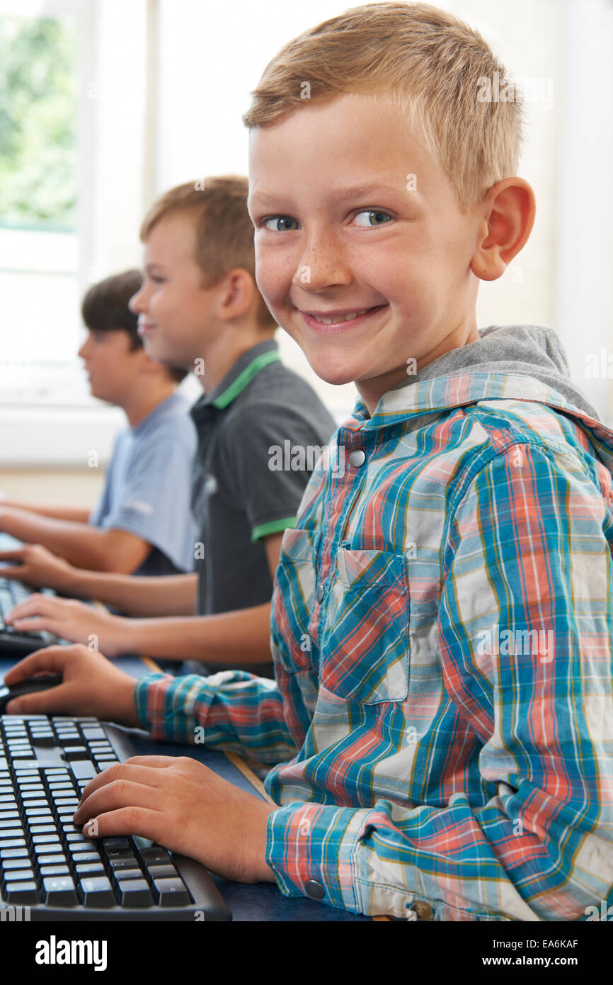 Group Of Male Elementary School Children In Computer Class Stock Photo