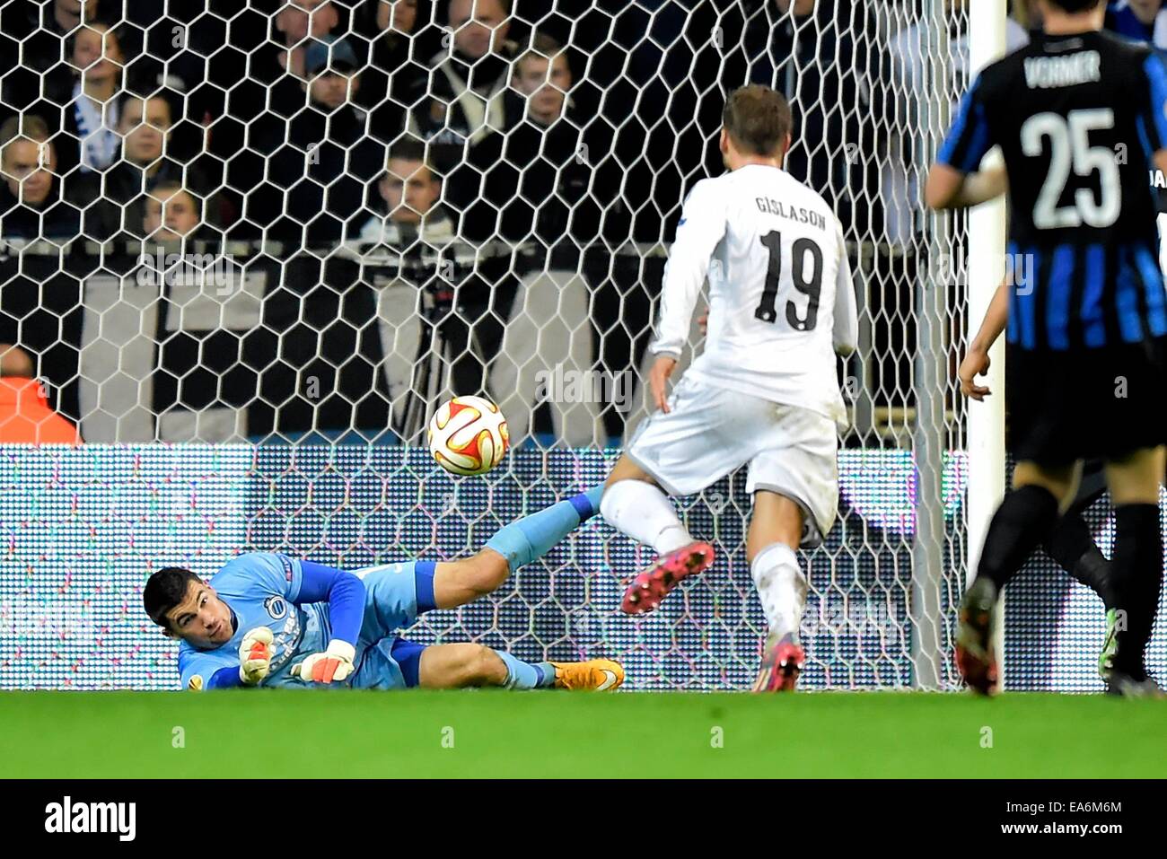 Copenhagen, Denmark. 06th Nov, 2014. UEFA Europa Cup football, group stages. FC Copenhagen versus Club Bruges.  Goalkeeper Mathew Ryan of Club Brugge stops a shot from Rurik Gislason of Copenhagen Credit:  Action Plus Sports Images/Alamy Live News Stock Photo