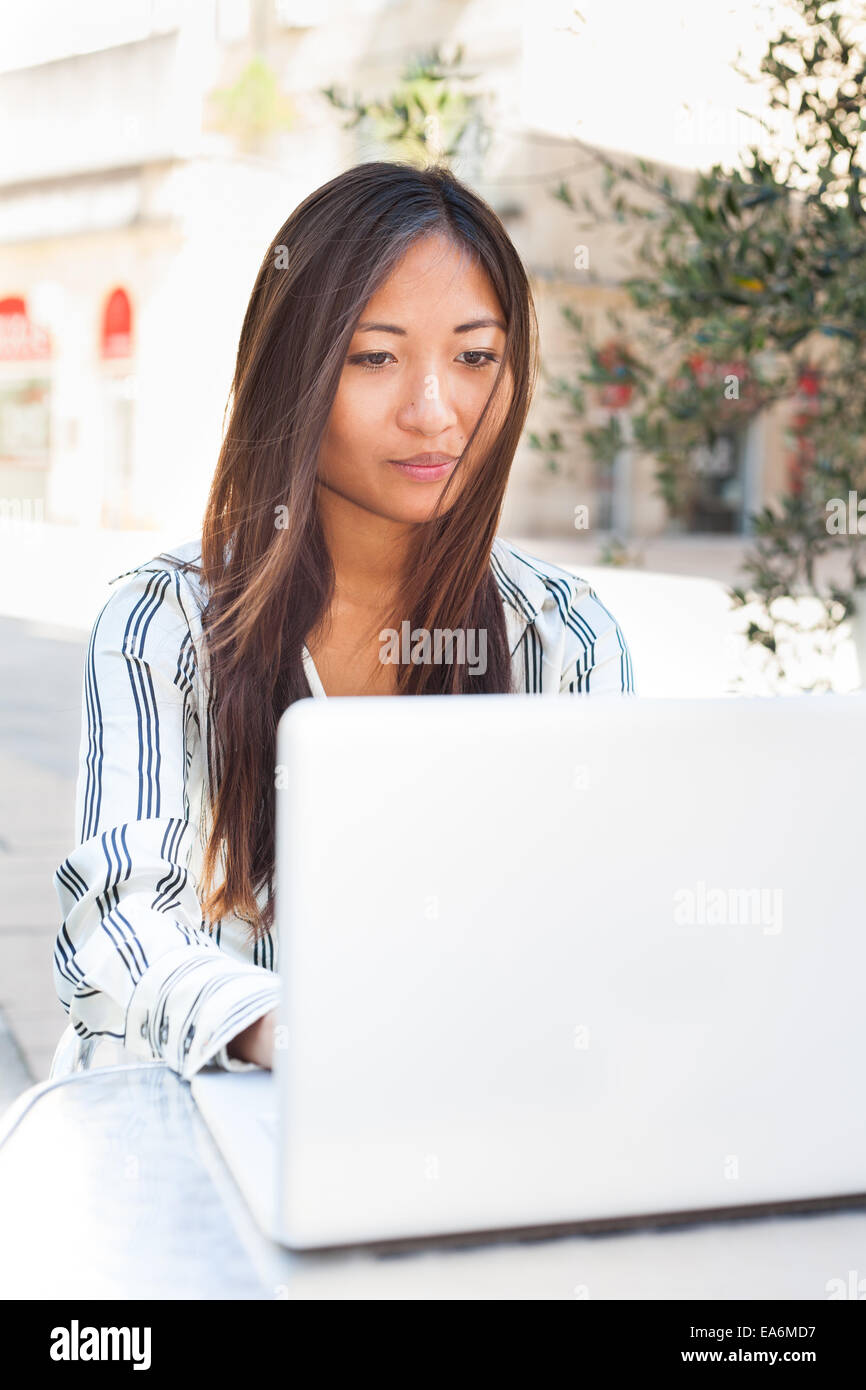 Beautiful asian girl using a laptop, businesswoman or student Stock Photo