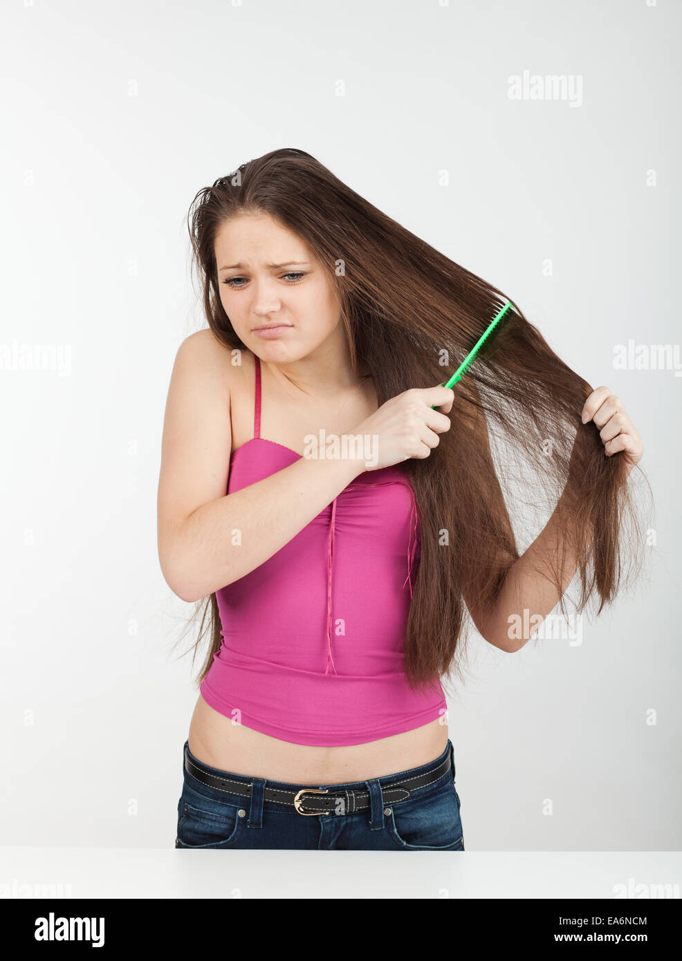girl combs her hair Stock Photo Alamy