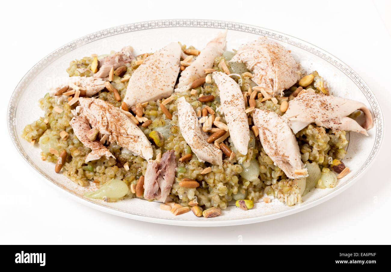 Lebanese cinnamon dusted chicken served on a bed of freekeh firedried