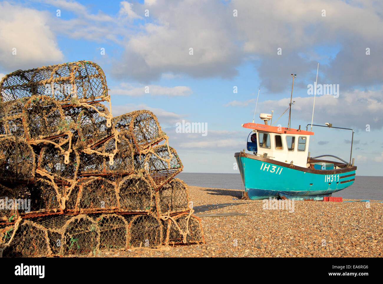A fishing boat and lobster pots on the Beach at Aldeburgh, Suffolk Stock Photo