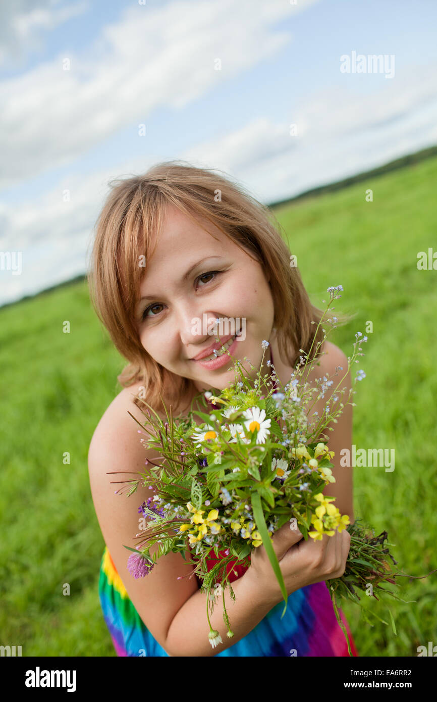 Portrait of a girl with wild flowers hi-res stock photography and ...
