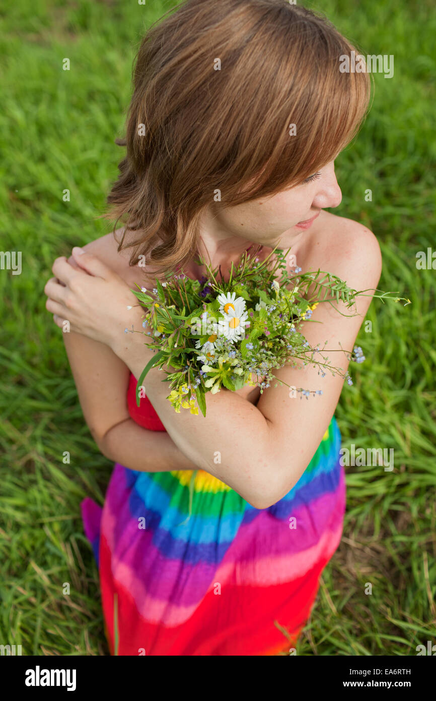 girl with a bouquet of wild flowers Stock Photo - Alamy