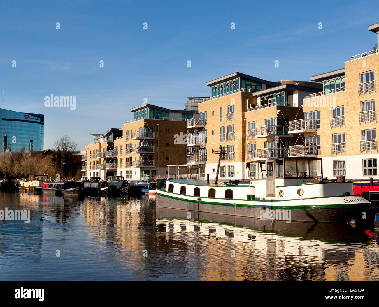 Apartments and canalboats on the Grand Union Canal at Brentford, London, UK Stock Photo