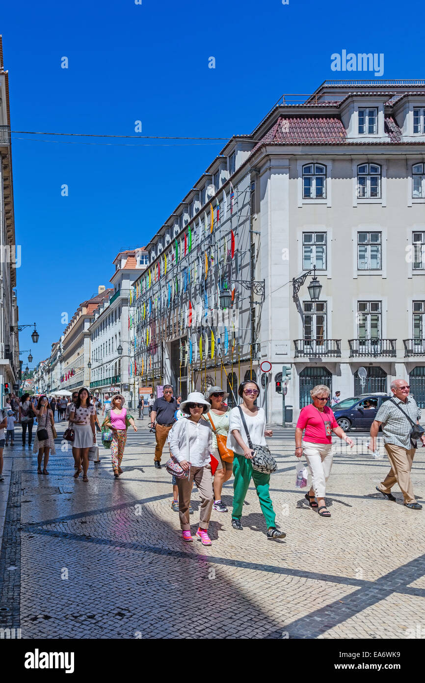 Rua Augusta Street in the Baixa District of Lisbon. The most cosmopolitan street of the capital is always full of people. Stock Photo