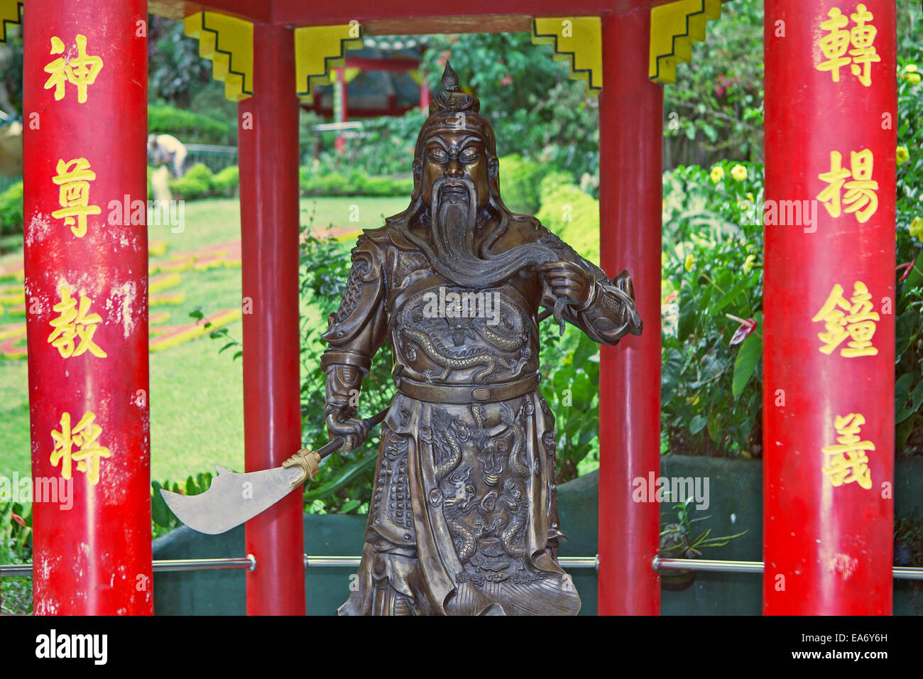 A lifesize bronze statue of an ancient Chinese soldier, The General, stands under a pagoda at