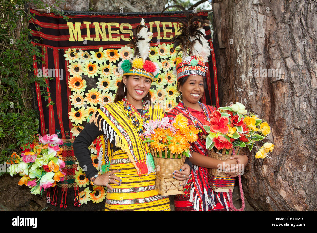 Two beautiful Filipina women dress in traditional Ifugao clothing at Mines View Park in Baguio City, Philippines. Stock Photo