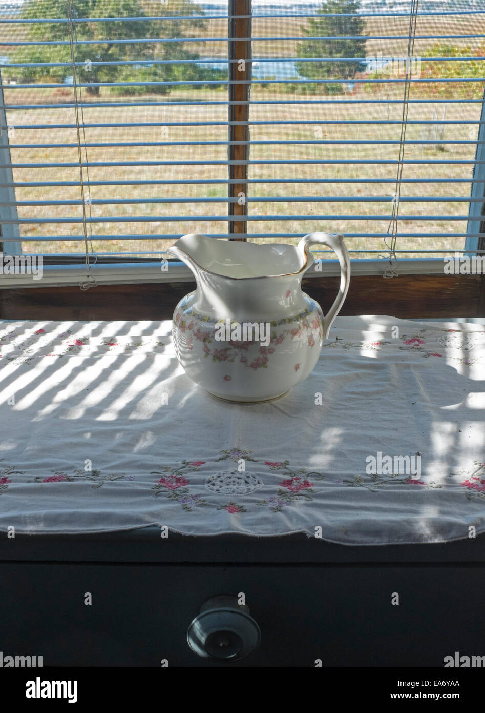 China Pitcher on Window Table Stock Photo