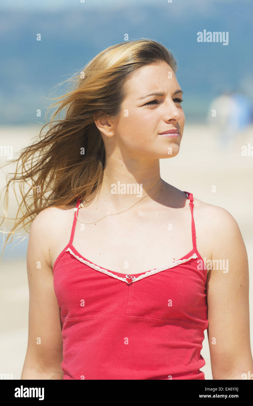 Portrait of a young woman with long blond hair on the beach; Tarifa ...