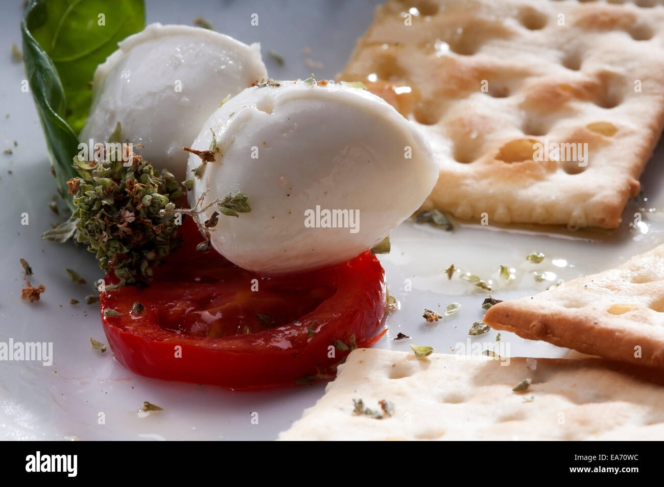 Caprese salad with buffalo milk mozzarella ,with olive oil, tomatoes and oregano. a typical Italian appetizer Stock Photo