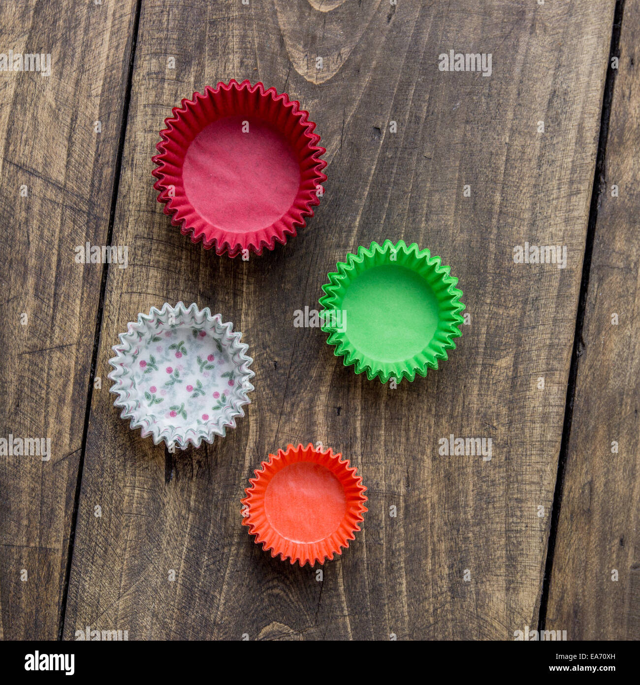 Stack of paper cupcake cups on table, from above Stock Photo - Alamy