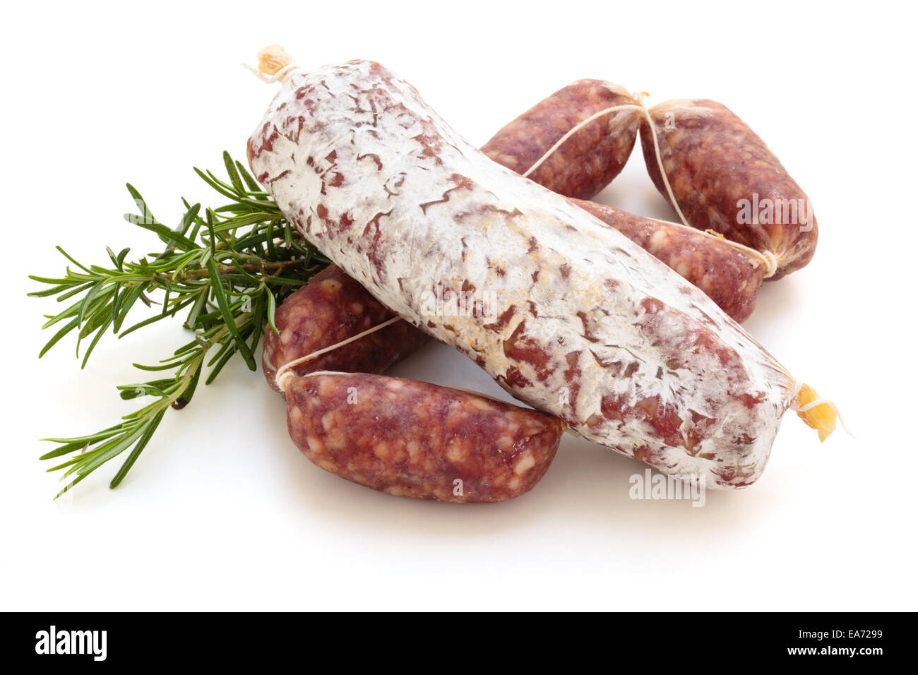 Rosemary and different kinds of italian salami. Isolated on white