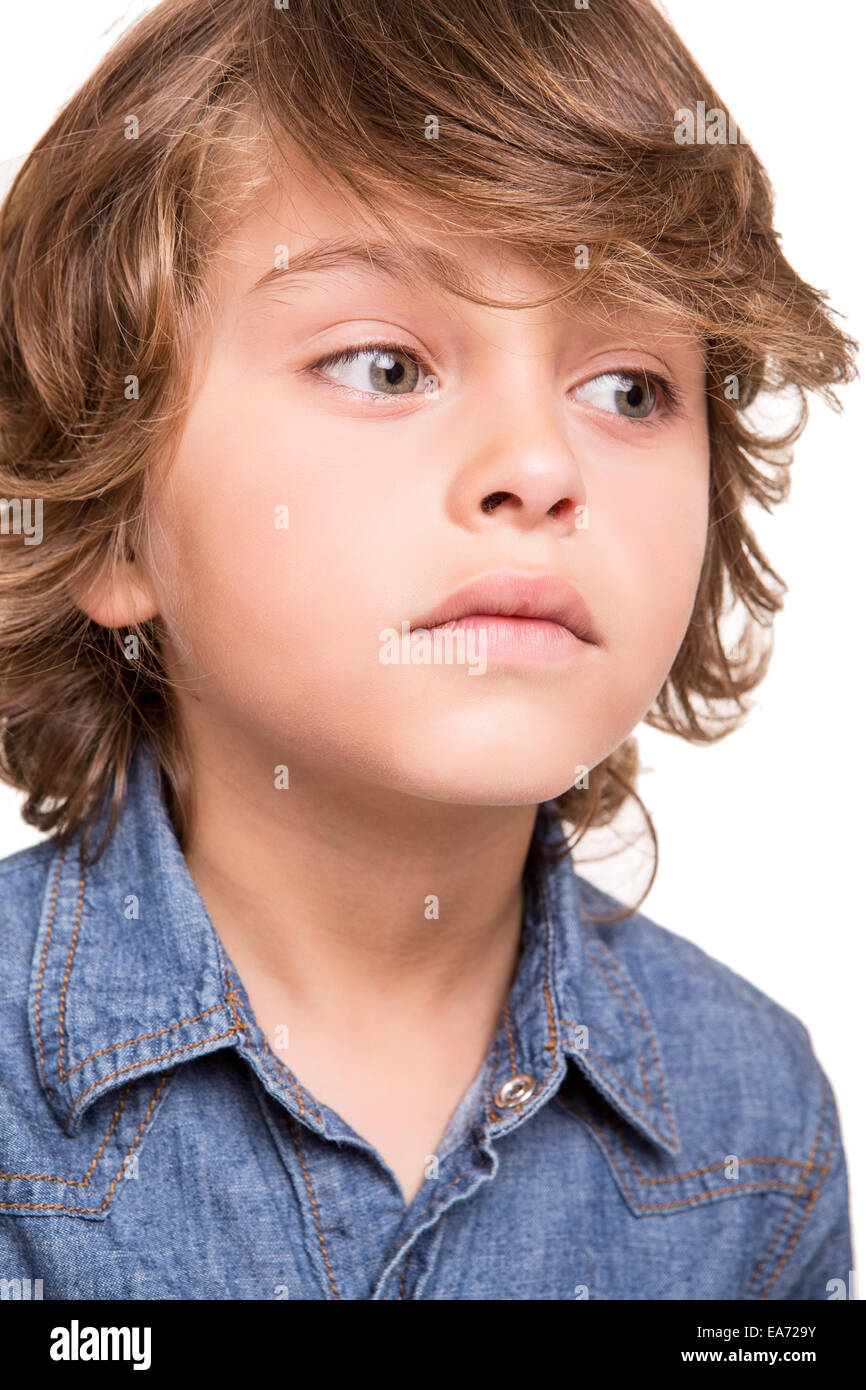 Cute Blond Boy Thinking Over White Background Stock Photo