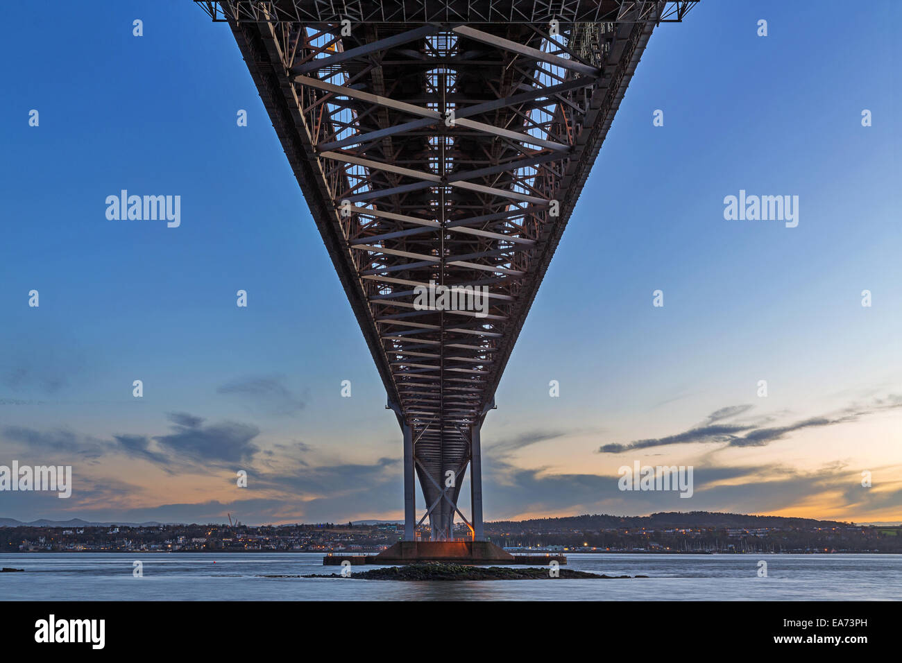 The Forth Road Bridge from below as seen from North Queensferry, Scotland not long after sunset Stock Photo