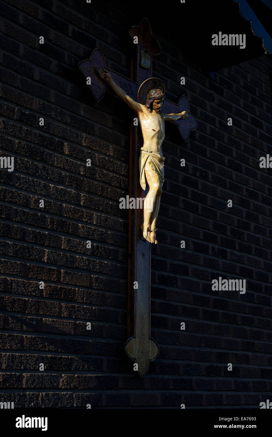 Christ on the Crucifix on the Franciscan Parish Church of Blessed John Duns Scotus, Gorbals, Glasgow. Stock Photo