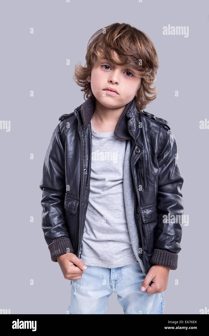 Fashion little boy wearing a leather jacket Stock Photo