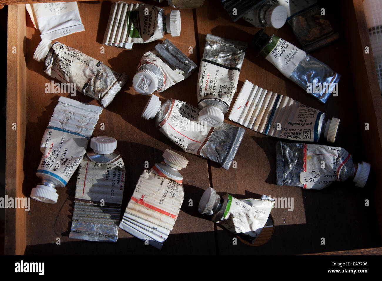 Watercolor tubes in an art studio. Stock Photo
