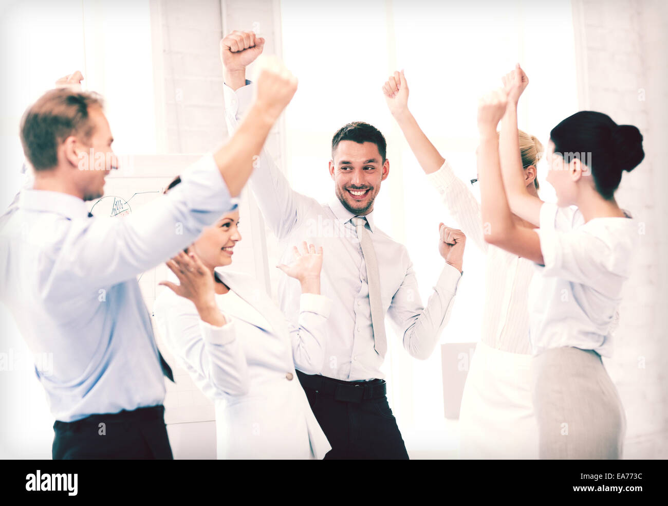 business team celebrating victory in office Stock Photo - Alamy